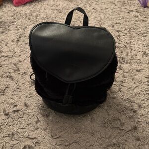 Black heart-shaped backpack with faux fur lining #backpacklove #fauxfur